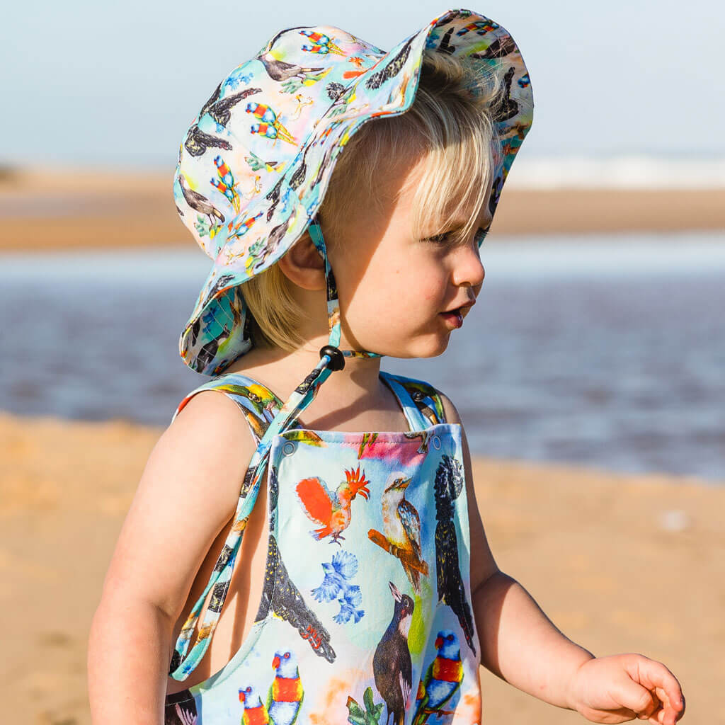 Boy Wearing Feathered Friends Beach Hat